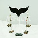 green piebald stone dangle earrings
