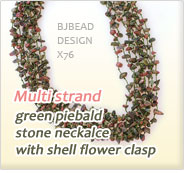 multi strand green piebald stone neckalce with shell flower clasp