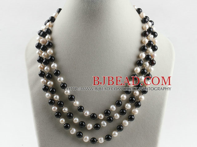 three strand white pearl and black agate necklace with shell flower clasp