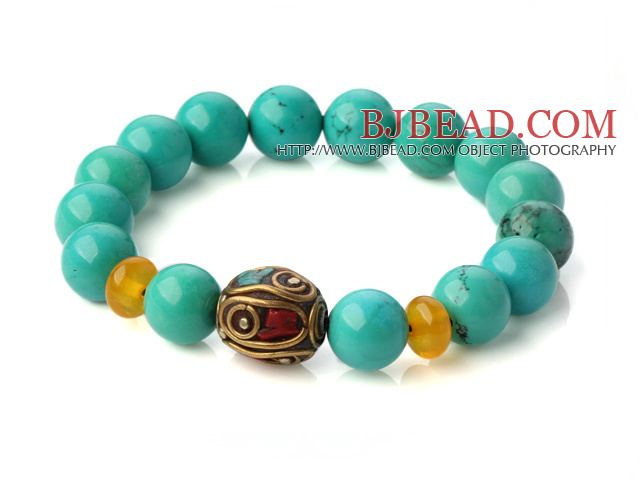 Popular Xinjiang Green Turquoise And Beeswax Beads Stretch Bracelet With Tibetan Charm