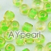 Glass seed beads, transparent inside green and yellow, 2.5mm round. Sold per pkg of 450 grams.